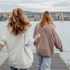 girls outdoors walking on pier