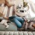 woman laying on couch with dog